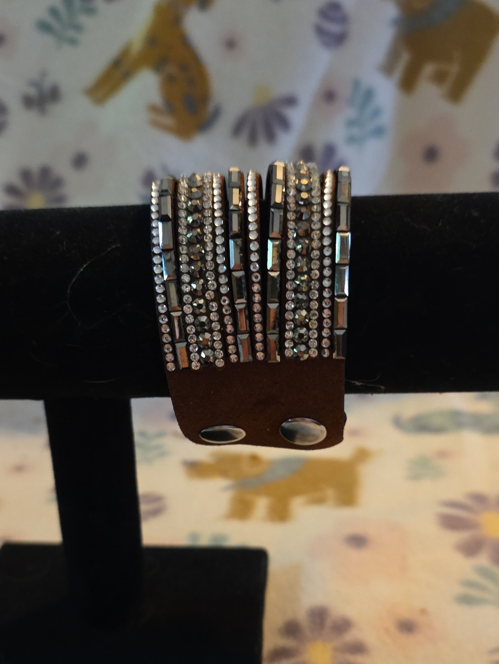 brown leather snap bracelet featuring multiple rows sparkling Silver rhinestones